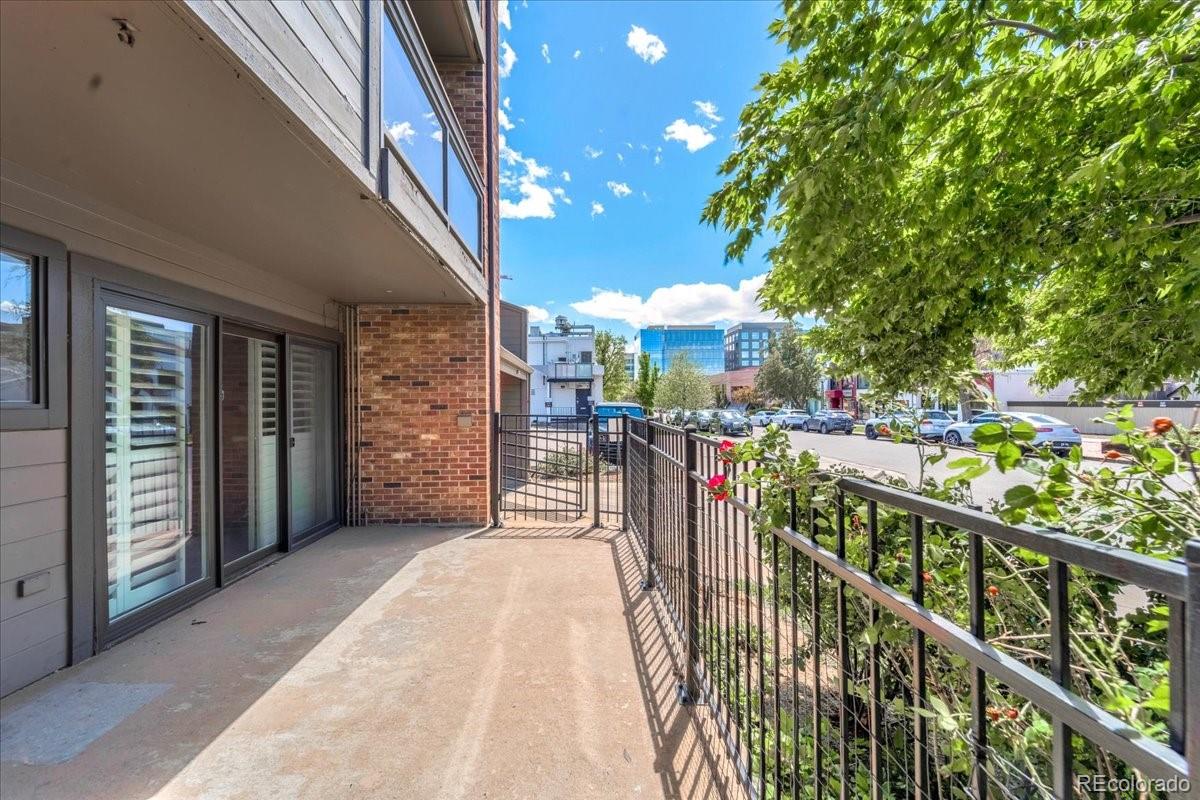 350 Detroit Street, Unit 103 Denver, CO 80206 - Photo 12 of 15 a view of a porch with wooden floor and stairs