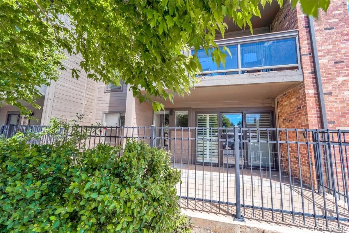 350 Detroit Street, Unit 103 Denver, CO 80206 - Photo 13 of 15 front view of a house with a garden