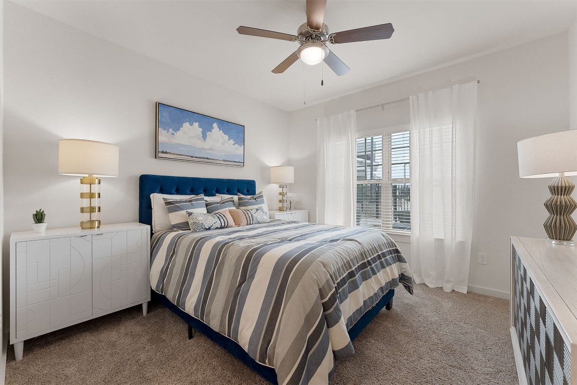 13301 Dessau Road, Unit 7303 Austin, TX 78754 - Photo 4 of 17 a bed room with a bed and a window