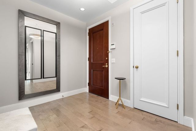 an empty room with closet and mirror