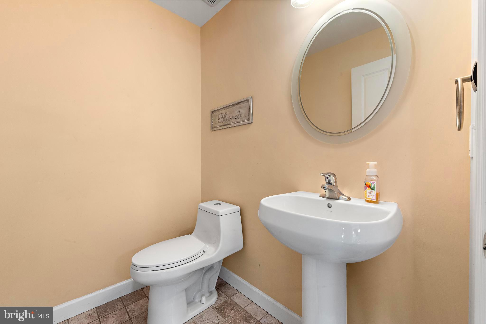 27 Parker Road Tuckerton, NJ 08087 - Photo 15 of 24 a bathroom with a sink a mirror and a toilet