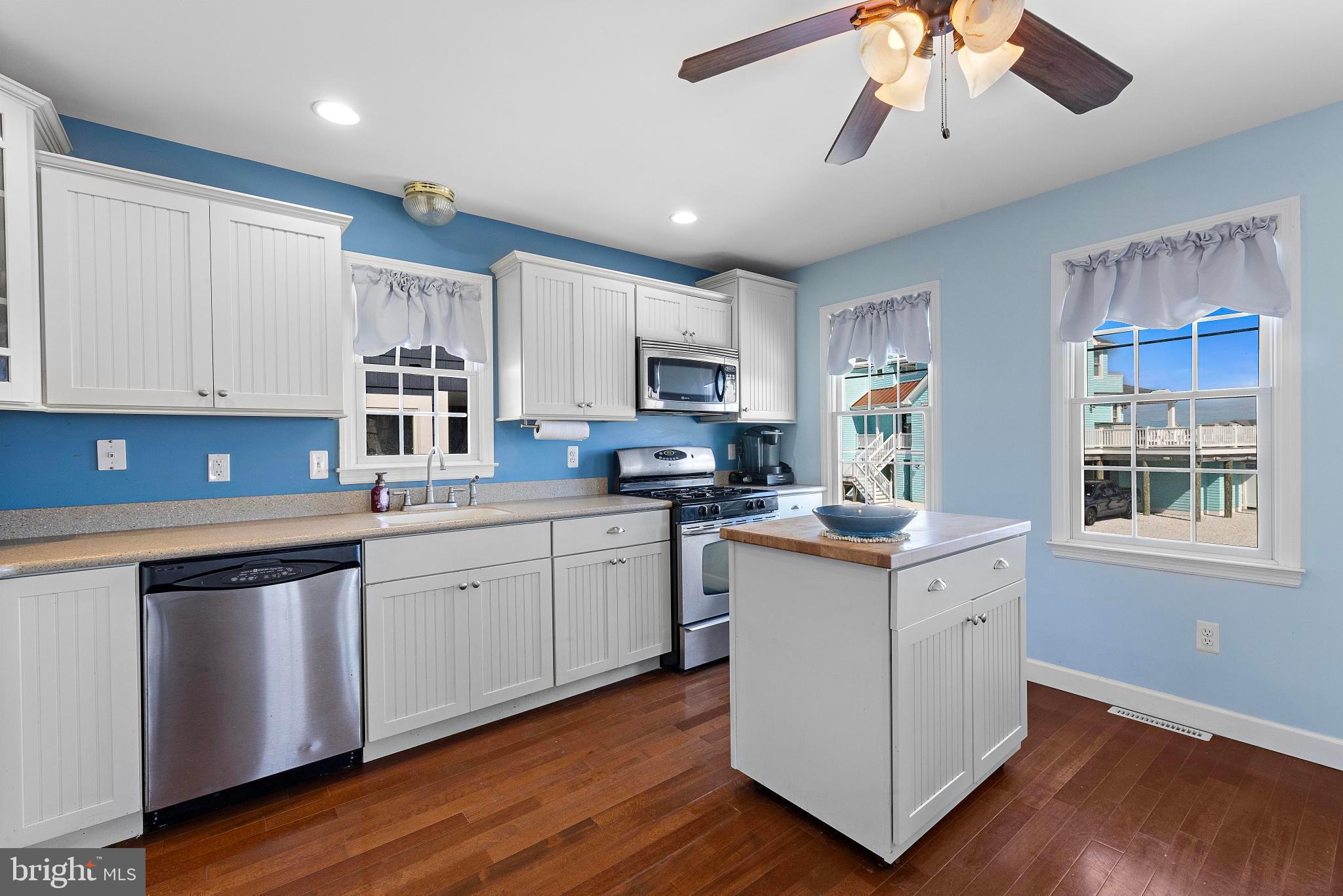 27 Parker Road Tuckerton, NJ 08087 - Photo 6 of 24 a kitchen with granite countertop appliances cabinets and a wooden floor