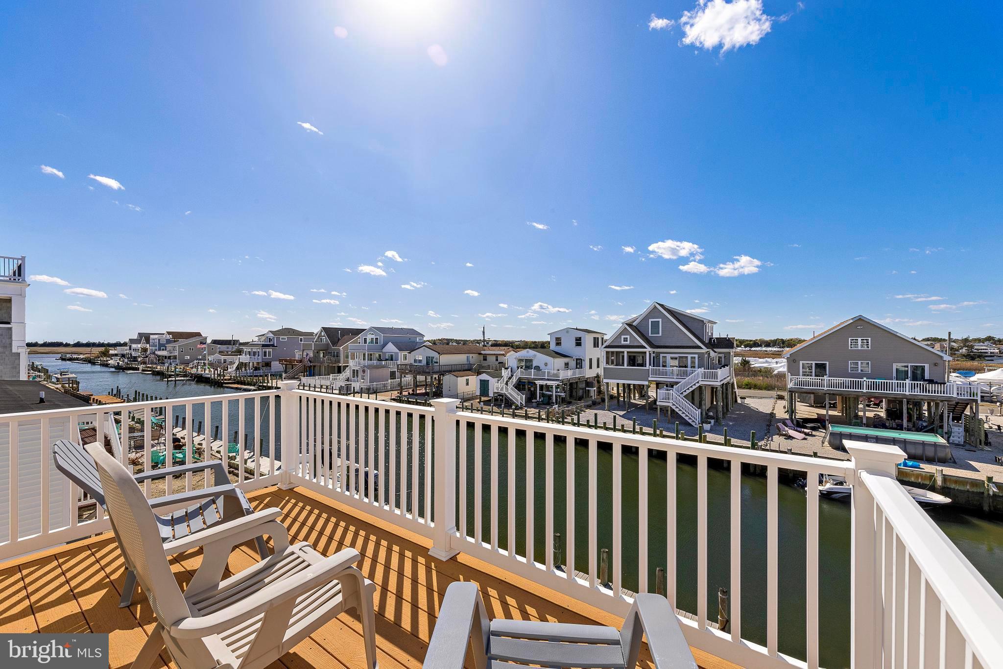 27 Parker Road Tuckerton, NJ 08087 - Photo 7 of 24 a view of a balcony with wooden chairs