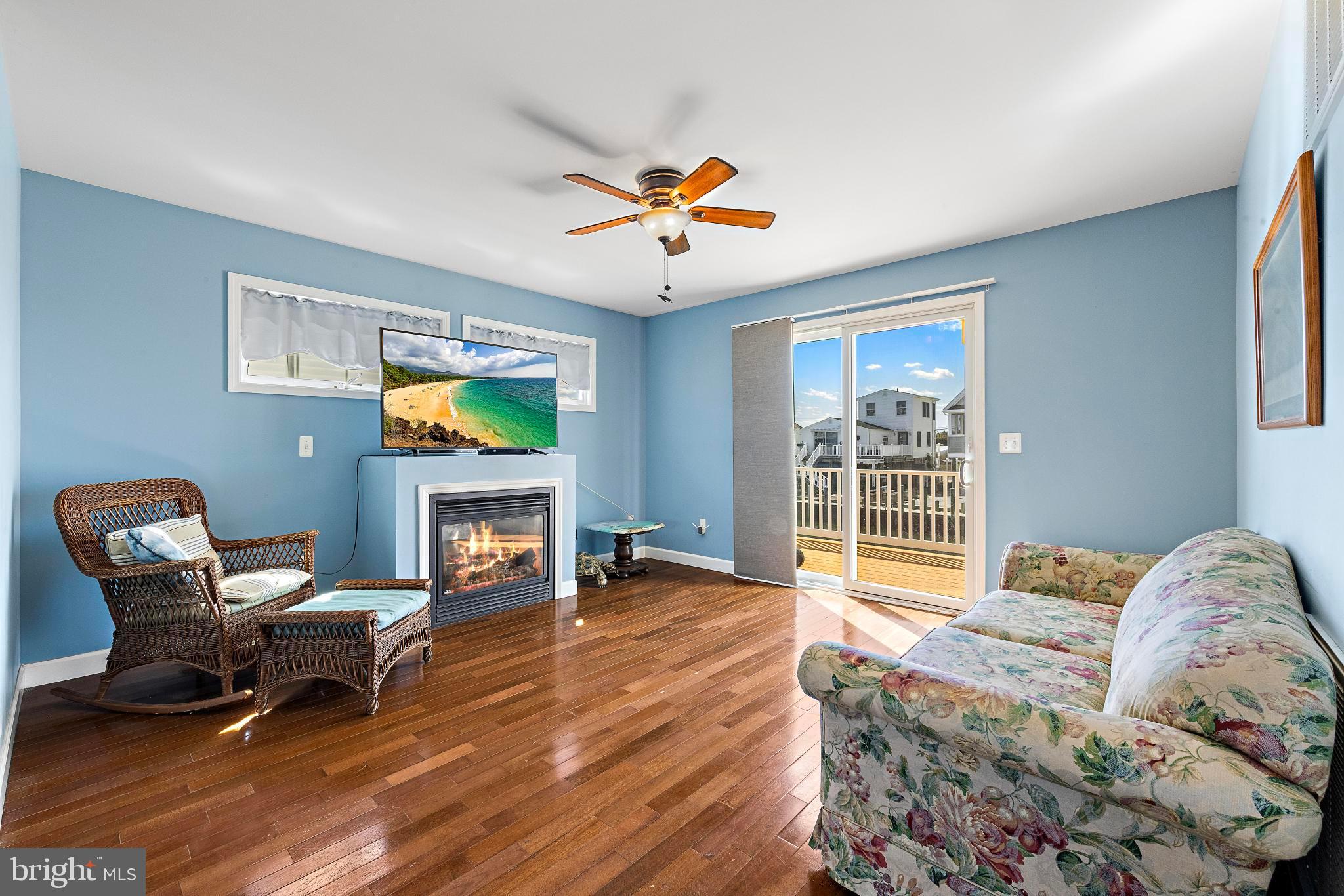 27 Parker Road Tuckerton, NJ 08087 - Photo 9 of 24 a living room with furniture and a fireplace