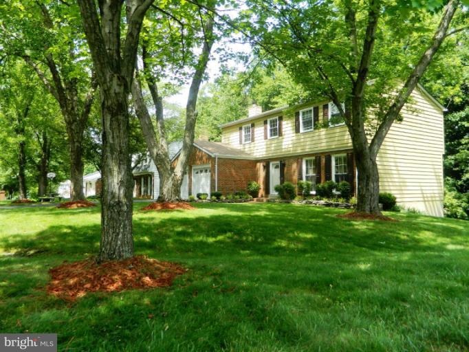 13289 Kenny Road Woodbridge, VA 22193 - Photo 1 of 23 a front view of a house with a yard