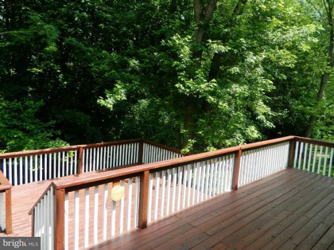 13289 Kenny Road Woodbridge, VA 22193 - Photo 2 of 23 a view of balcony with wooden floor