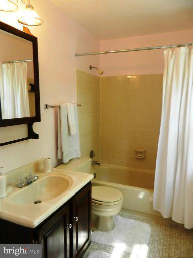13289 Kenny Road Woodbridge, VA 22193 - Photo 12 of 23 a bathroom with a sink a toilet and shower