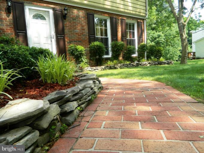 13289 Kenny Road Woodbridge, VA 22193 - Photo 17 of 23 a view of a pathway with a yard