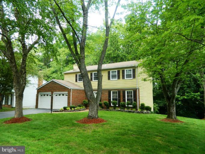 13289 Kenny Road Woodbridge, VA 22193 - Photo 18 of 23 a front view of a house with a yard and trees
