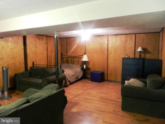 13289 Kenny Road Woodbridge, VA 22193 - Photo 22 of 23 a bedroom with furniture and a closet