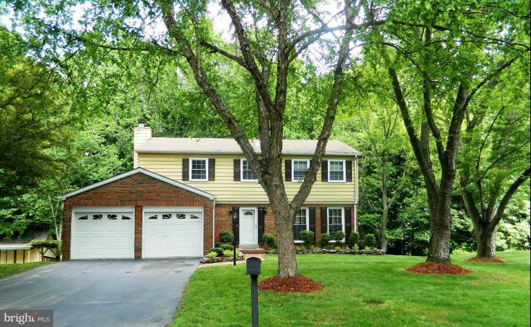 13289 Kenny Road Woodbridge, VA 22193 - Photo 23 of 23 a front view of a house with a garden