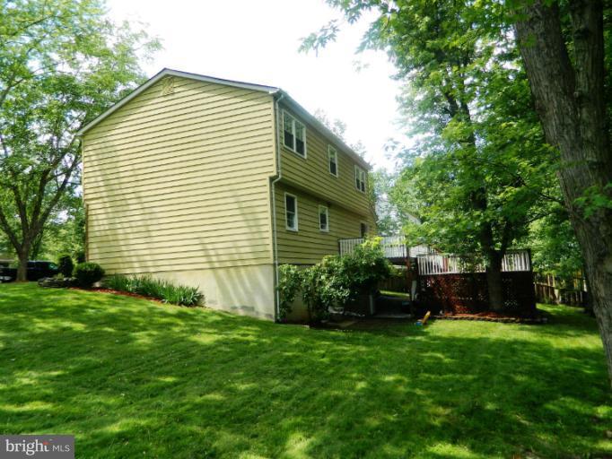 13289 Kenny Road Woodbridge, VA 22193 - Photo 7 of 23 a front view of a house with garden
