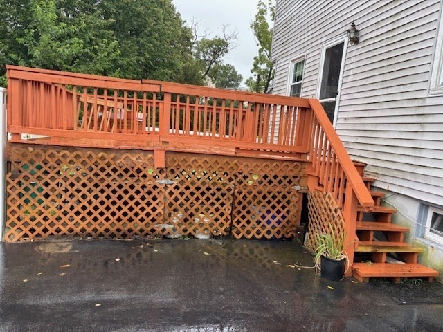 4 Bartlett Drive, Unit A Woburn, MA 01801 - Photo 3 of 14 a view of a wooden house with a large window