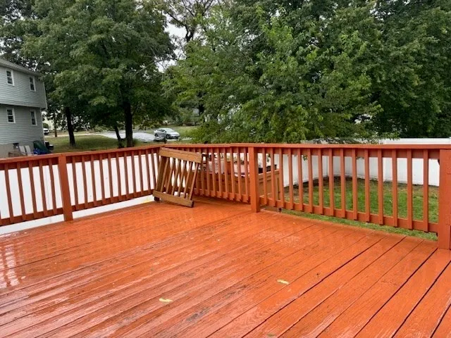 a view of deck with a flat screen tv
