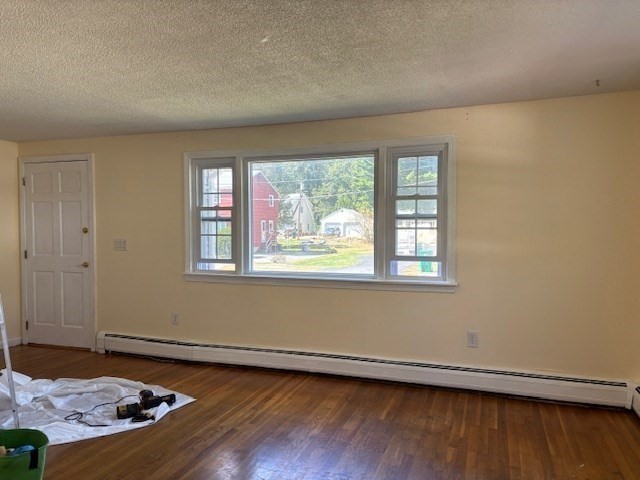 4 Bartlett Drive, Unit A Woburn, MA 01801 - Photo 7 of 14 an empty room with wooden floor and window