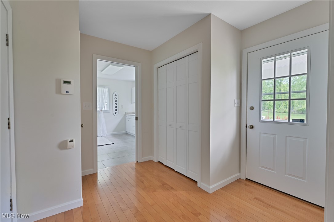 7091 South Raccoon Road Canfield, OH 44406 - Photo 17 of 39 Foyer entrance featuring light wood-type flooring and baseboards