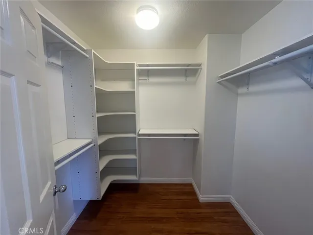 a bathroom with a double vanity sink mirror and shower