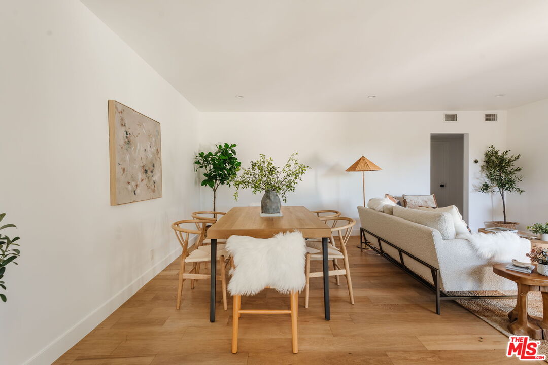 1943 12th, Unit 2 Santa Monica, CA 90404 - Photo 11 of 38 a dining room with furniture and wooden floor