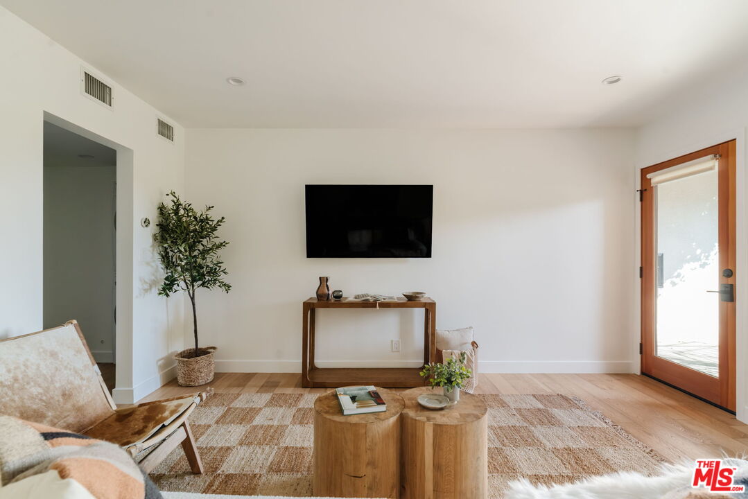 1943 12th, Unit 2 Santa Monica, CA 90404 - Photo 37 of 38 a living room with furniture and a flat screen tv