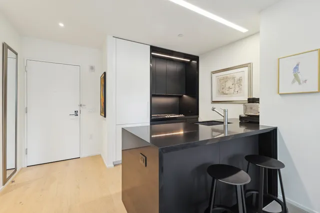 a dining room with a desk and chairs