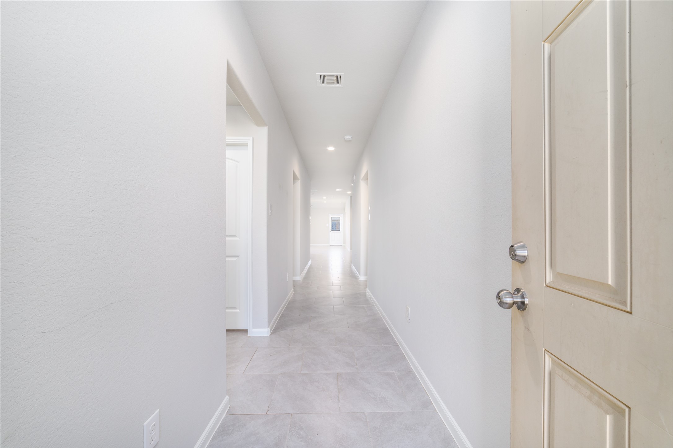 8307 Oakleaf Meadow Court Rosharon, TX 77583 - Photo 6 of 39 a view of a hallway with wooden floor