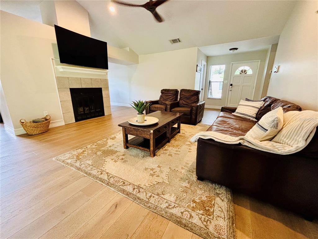 1045 Shaffer Trail Oviedo, FL 32765 - Photo 5 of 30 a living room with furniture fireplace and flat screen tv