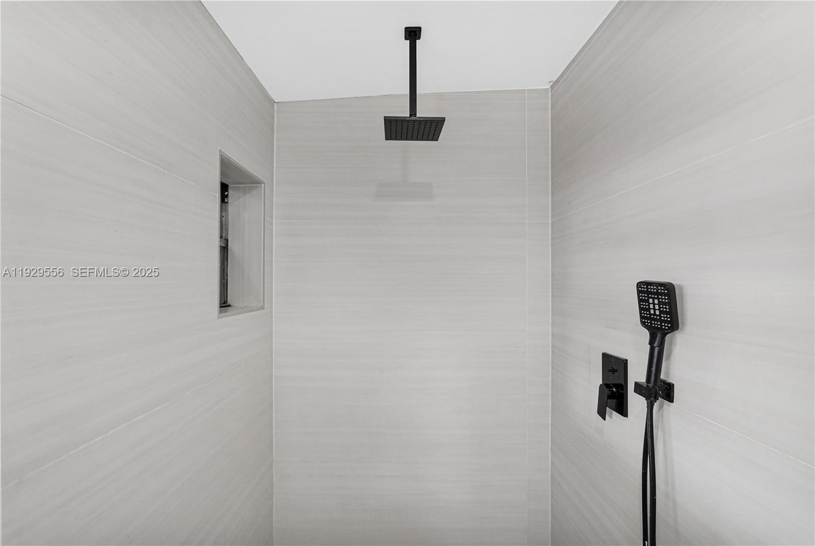 47 Northwest 49th Street, Unit 3 Miami, FL 33127 - Photo 12 of 47 a bathroom with a shower