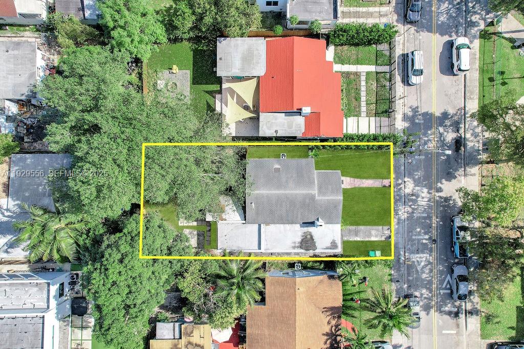 47 Northwest 49th Street, Unit 3 Miami, FL 33127 - Photo 17 of 47 an aerial view of a house with a garden and lake view