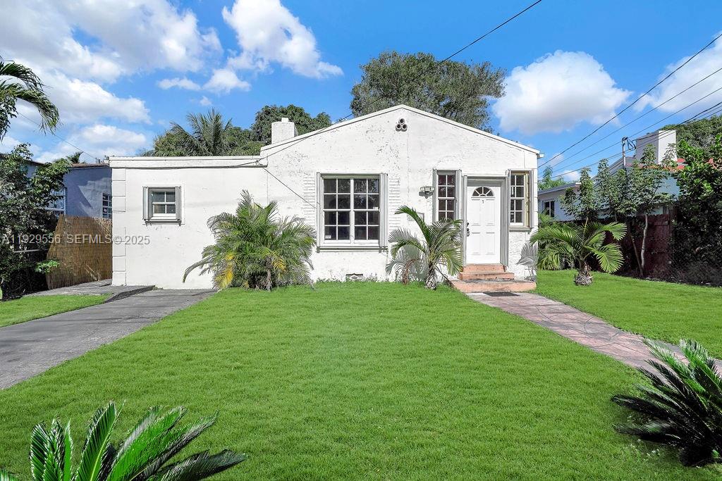 47 Northwest 49th Street, Unit 3 Miami, FL 33127 - Photo 32 of 47 a front view of house with yard and green space