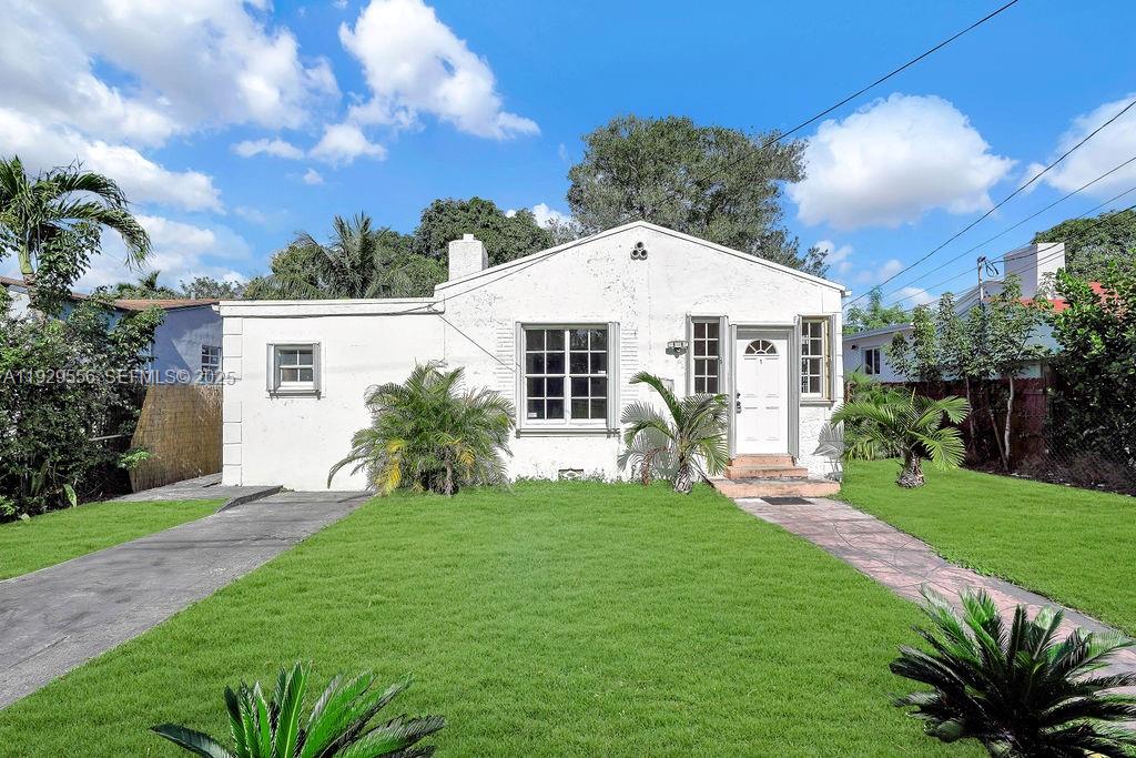 47 Northwest 49th Street, Unit 3 Miami, FL 33127 - Photo 34 of 47 a front view of a house with a yard