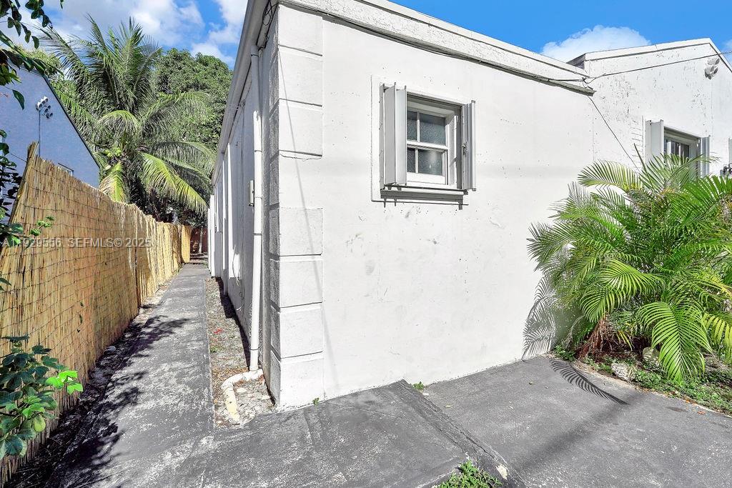 47 Northwest 49th Street, Unit 3 Miami, FL 33127 - Photo 37 of 47 a view of a pathway of a house with a small yard