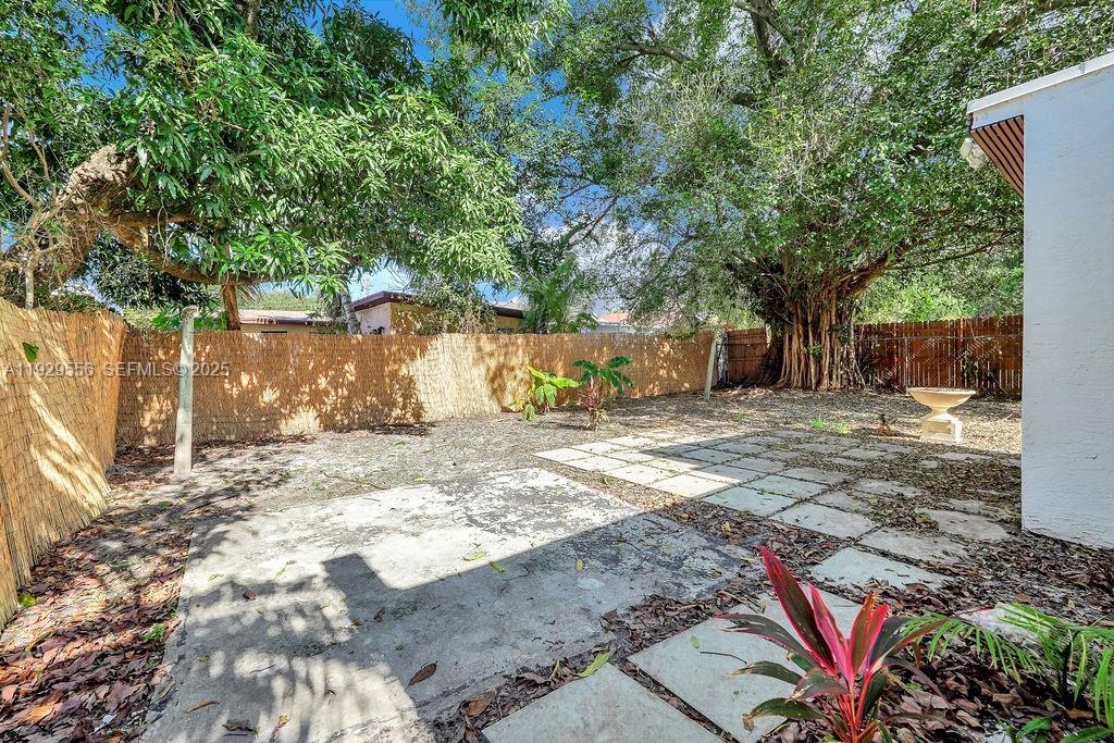 47 Northwest 49th Street, Unit 3 Miami, FL 33127 - Photo 38 of 47 a view of a yard with plants and trees