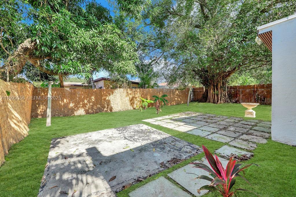 47 Northwest 49th Street, Unit 3 Miami, FL 33127 - Photo 39 of 47 front view of a house with a yard