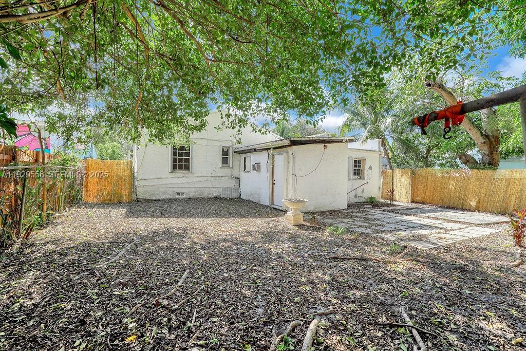 47 Northwest 49th Street, Unit 3 Miami, FL 33127 - Photo 44 of 47 a backyard of a house with oven and garage