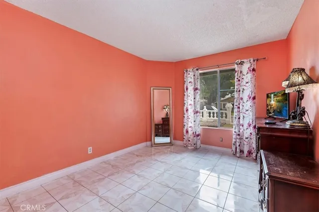 a view of an empty room with a fireplace