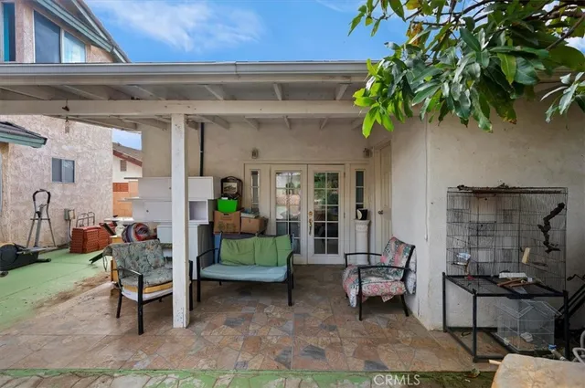 a backyard of a house with outdoor seating
