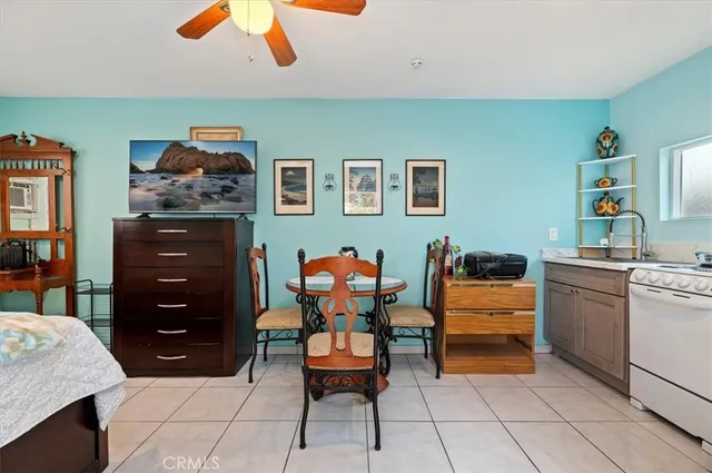 a bedroom with furniture and a dresser