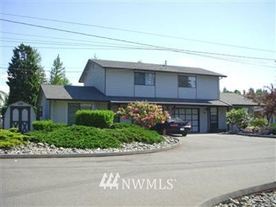 7416 Lower Ridge Road Everett, WA 98203 - Photo 1 of 1 a front view of a house with a yard and a garage