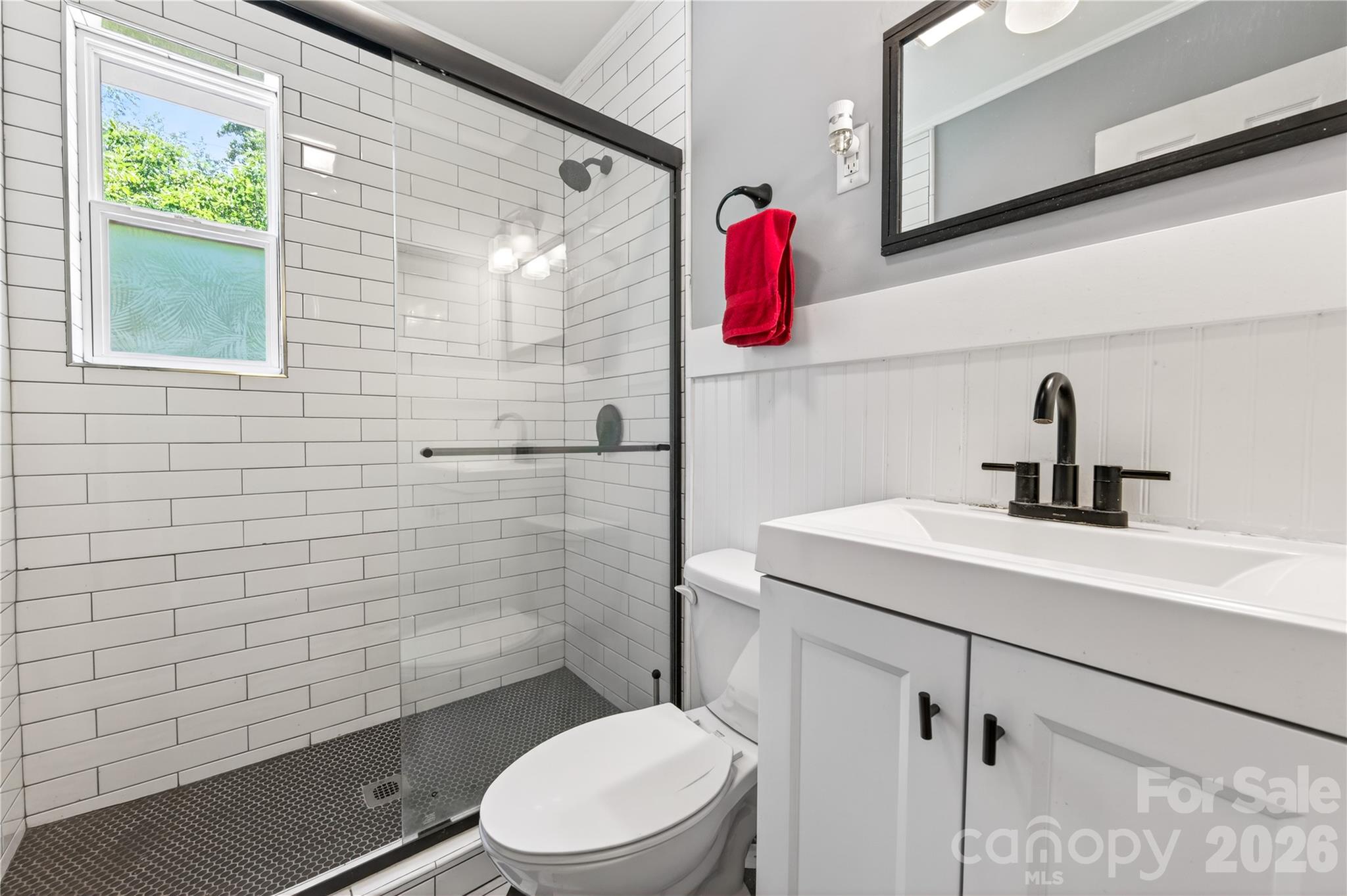 3241 Minnesota Road Charlotte, NC 28208 - Photo 16 of 18 a bathroom with a sink toilet and shower
