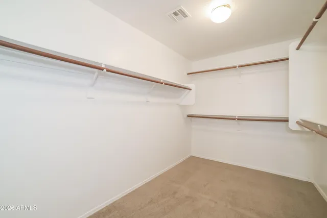 a view of an empty walk in closet