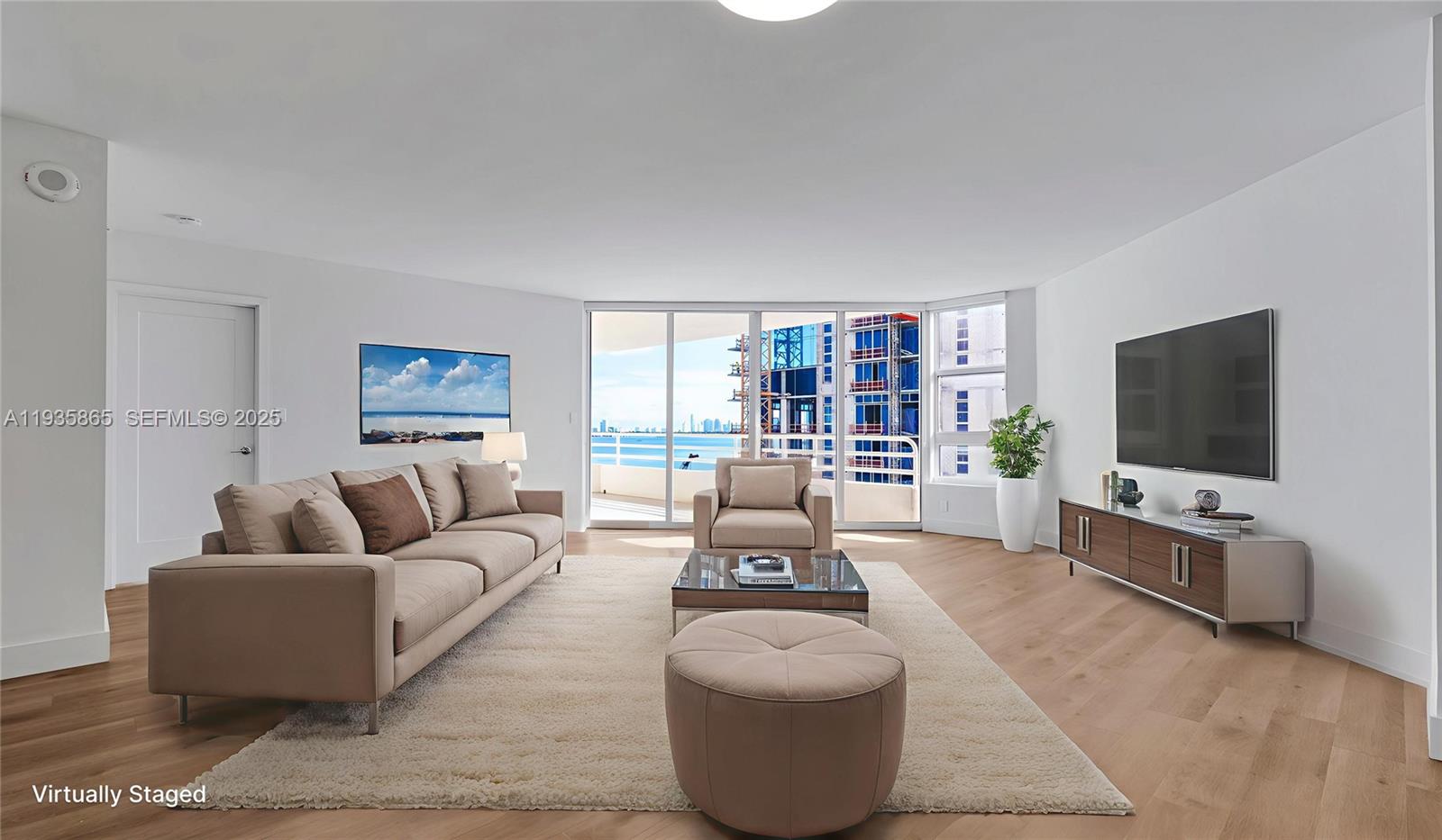 555 Northeast 34th Street, Unit 2209 Miami, FL 33137 - Photo 11 of 32 a living room with furniture and a flat screen tv