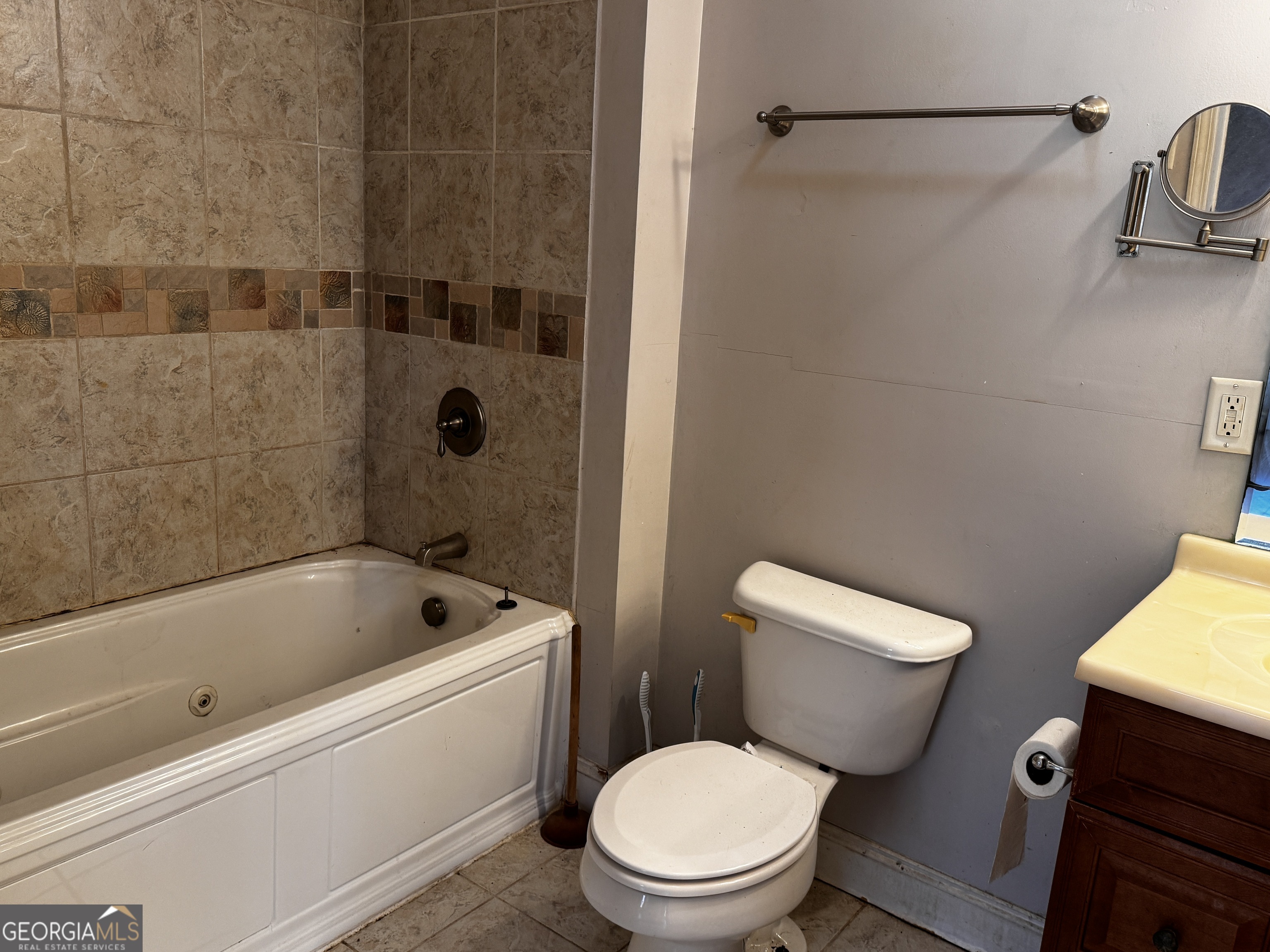 22 Ilene Drive Cleveland, GA 30528 - Photo 29 of 53 a white toilet and tub sitting next to a bathroom sink