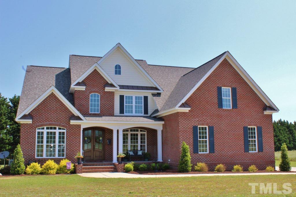 5820 Farmstead Road Bailey, NC 27807 - Photo 2 of 25 a front view of a house with a yard