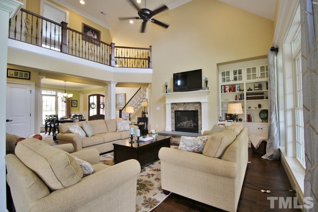 5820 Farmstead Road Bailey, NC 27807 - Photo 13 of 25 a living room with furniture a flat screen tv and a fireplace