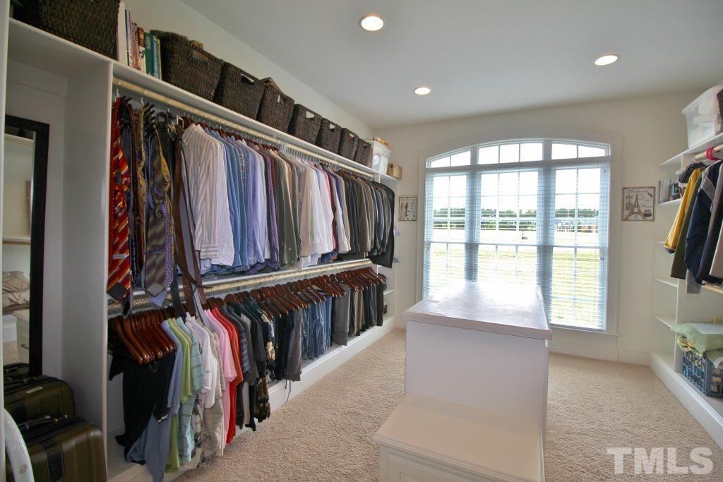 5820 Farmstead Road Bailey, NC 27807 - Photo 14 of 25 a view of walk in closet with clothes and shoes
