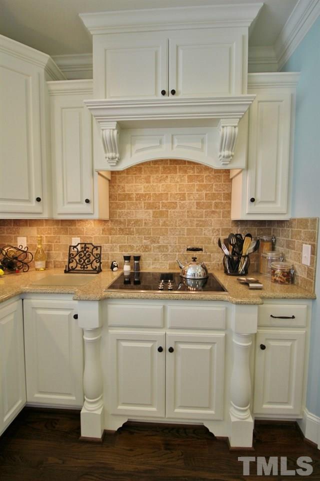 5820 Farmstead Road Bailey, NC 27807 - Photo 18 of 25 a kitchen with white cabinets and sink