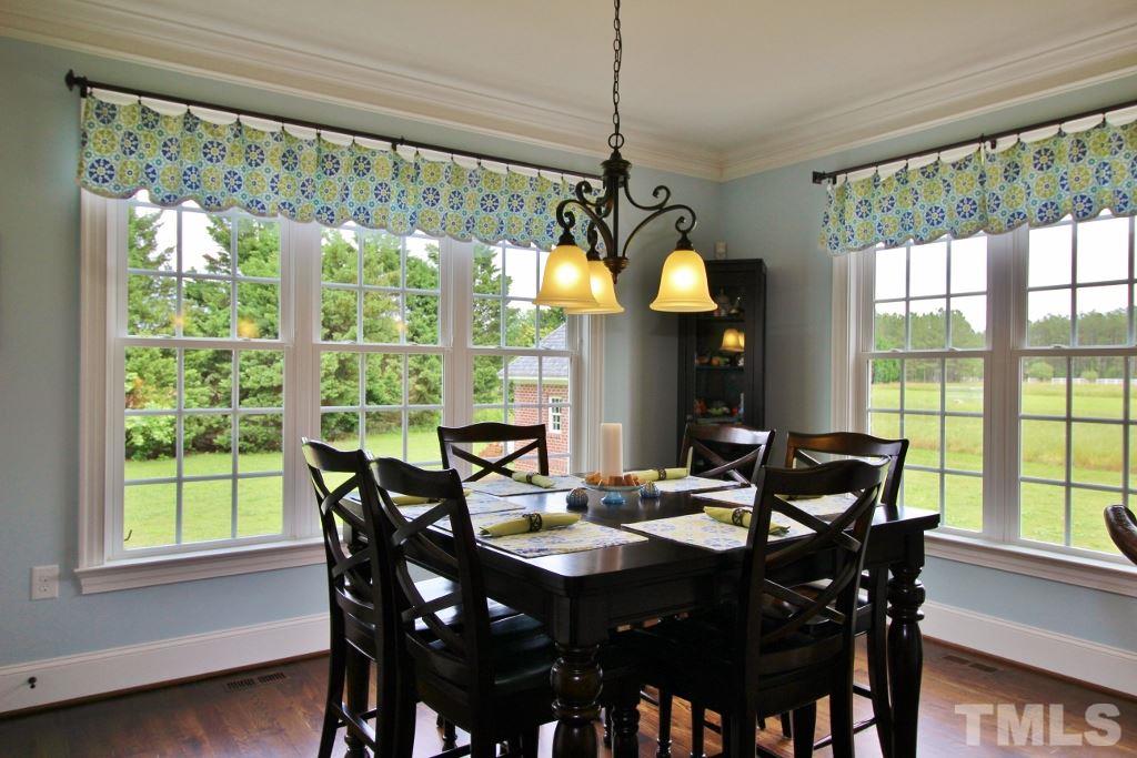 5820 Farmstead Road Bailey, NC 27807 - Photo 20 of 25 a view of a dining room with furniture window and outside view