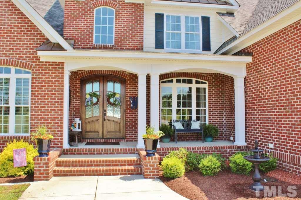 5820 Farmstead Road Bailey, NC 27807 - Photo 3 of 25 a front view of a house with a garden