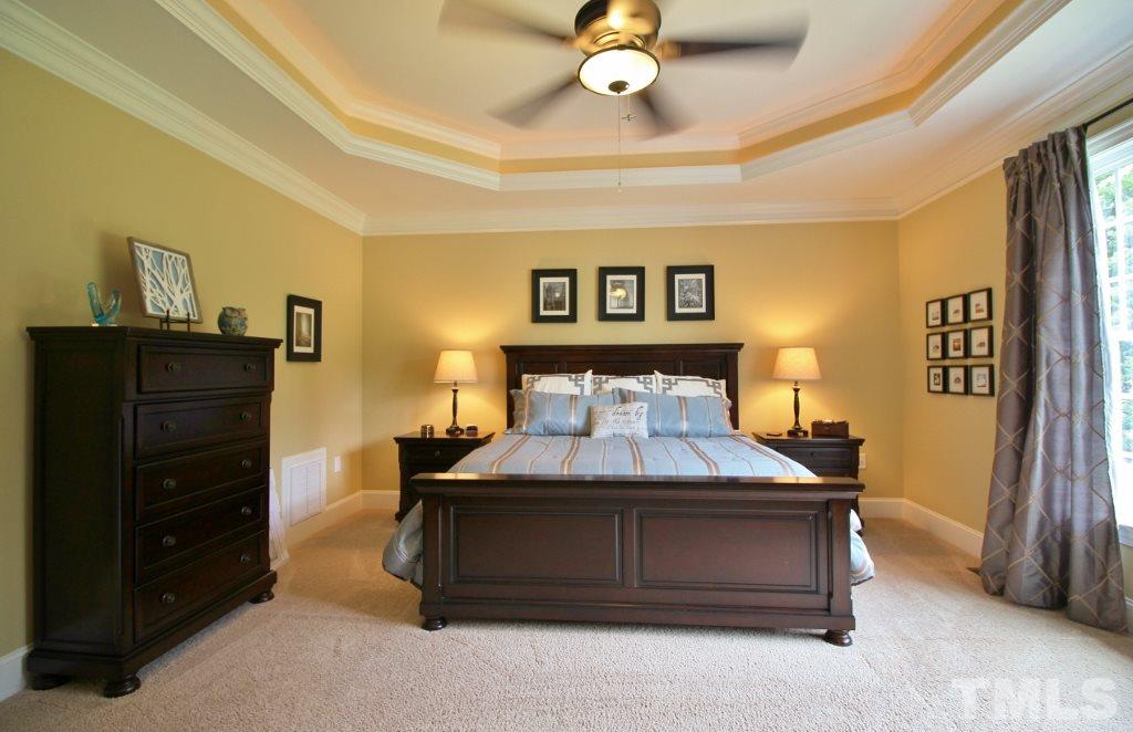 5820 Farmstead Road Bailey, NC 27807 - Photo 23 of 25 a bedroom with a bed and cabinet