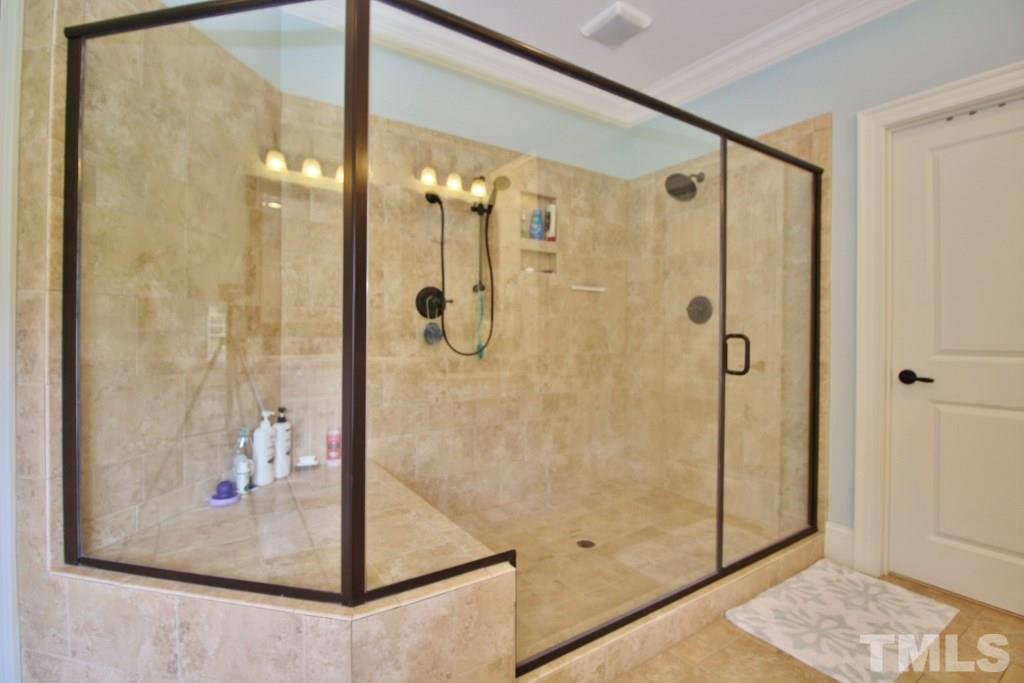 5820 Farmstead Road Bailey, NC 27807 - Photo 25 of 25 a bathroom with a glass shower door
